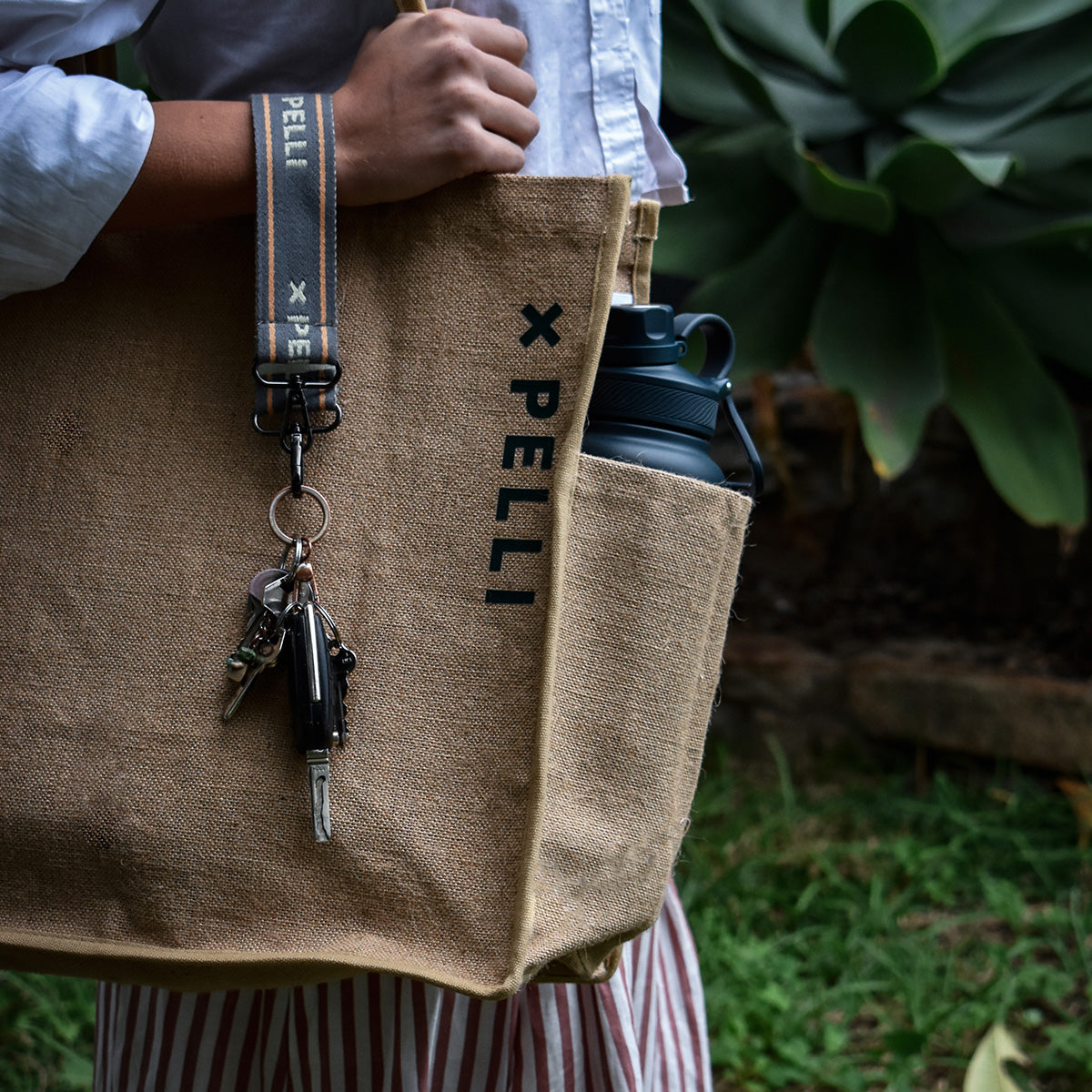 A Recycled Hessian Or Jute Shopping Bag With Wooden Handles Isolated On