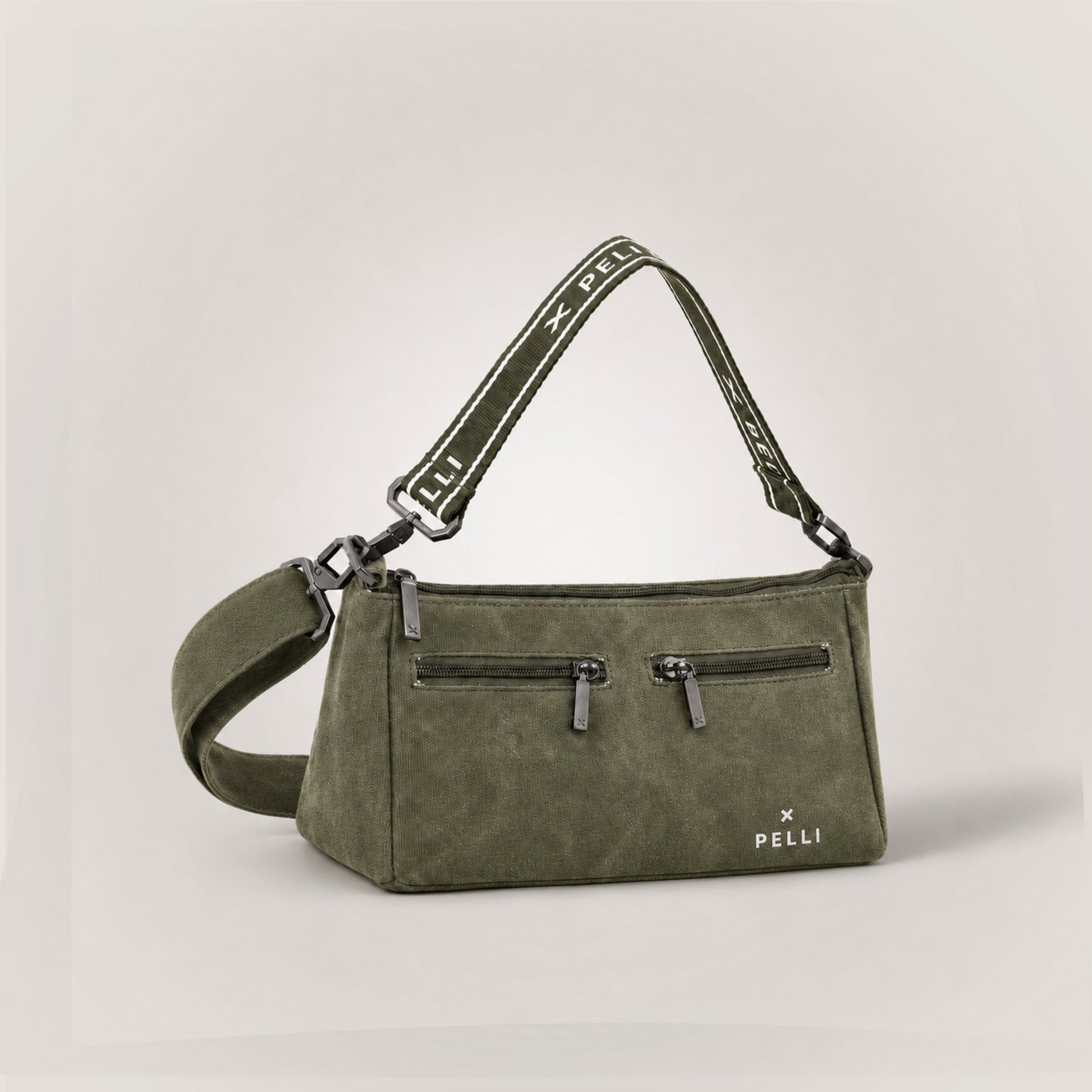 The Wanderer waxed canvas crossbody bag in Burnt Olive - angled view