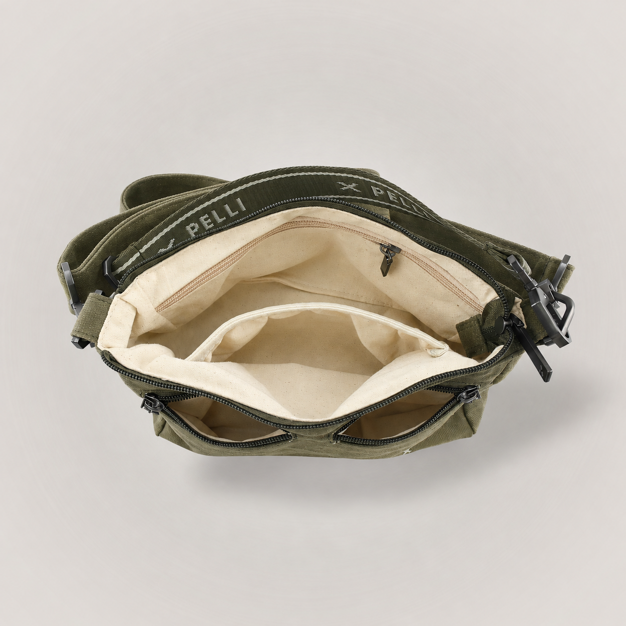 Inside The Wanderer waxed canvas crossbody bag showing five pockets