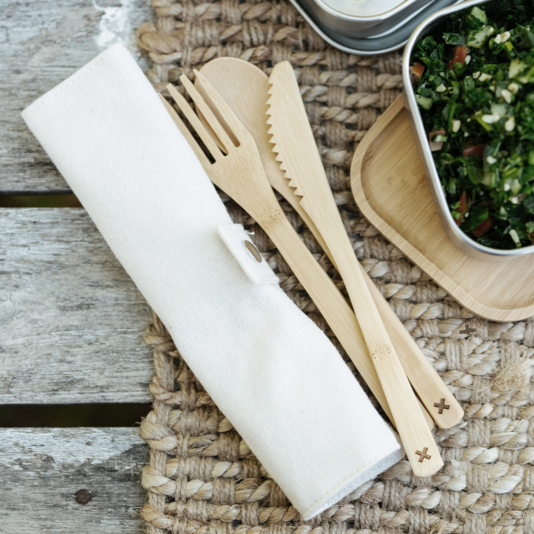 A Pelli reusable bamboo cutlery set on the table